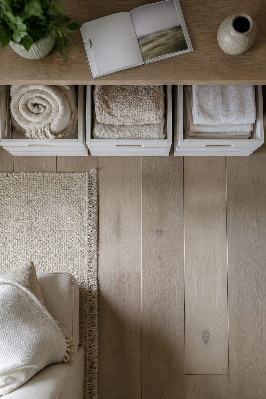 Wooden crates used for storing rolled blankets and towels.