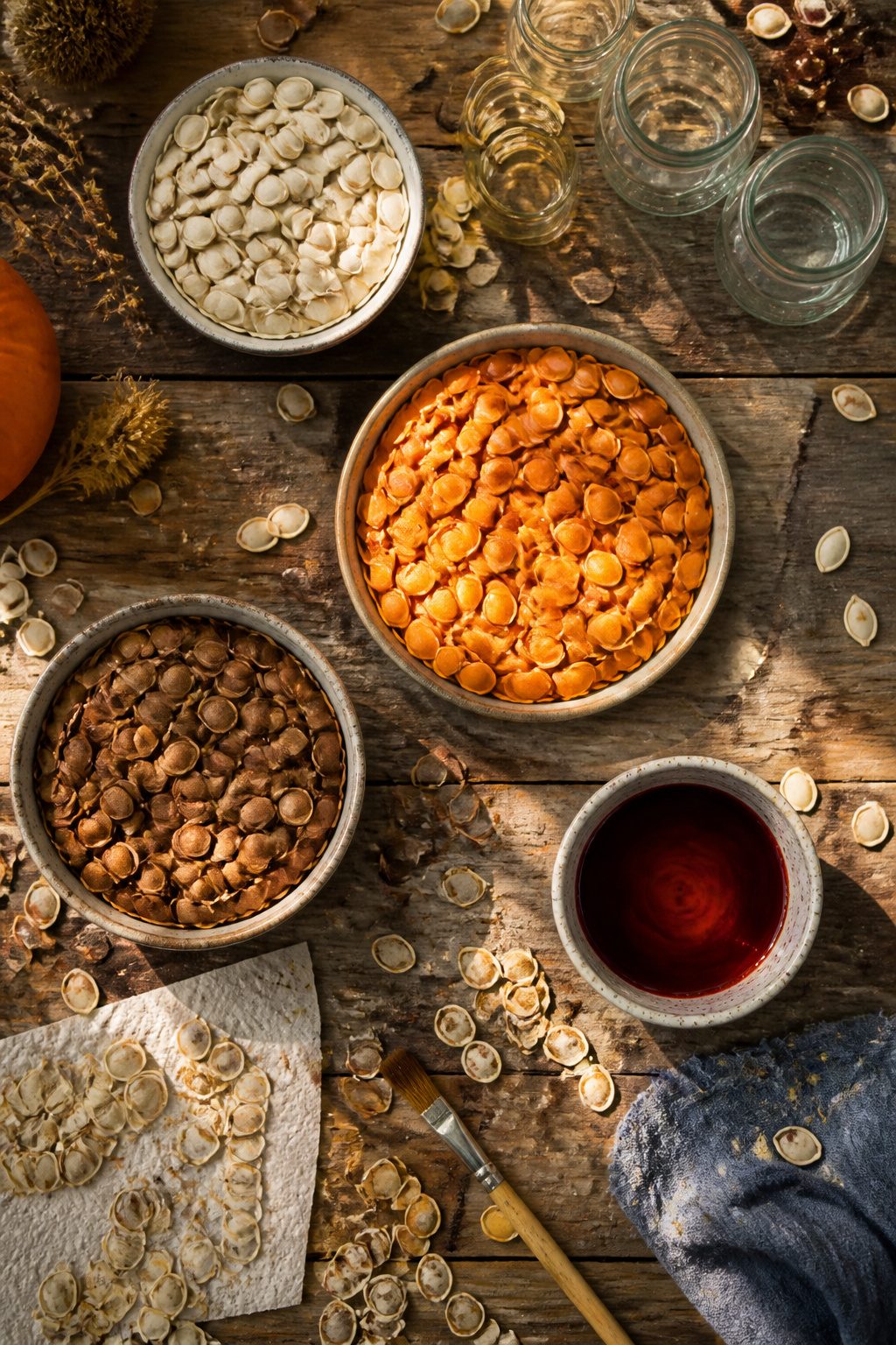 25 Pumpkin Craft Ideas for Fall Decor, Kids, and Adults (2026) 17 Pumpkin seeds drying on a baking sheet for crafting.