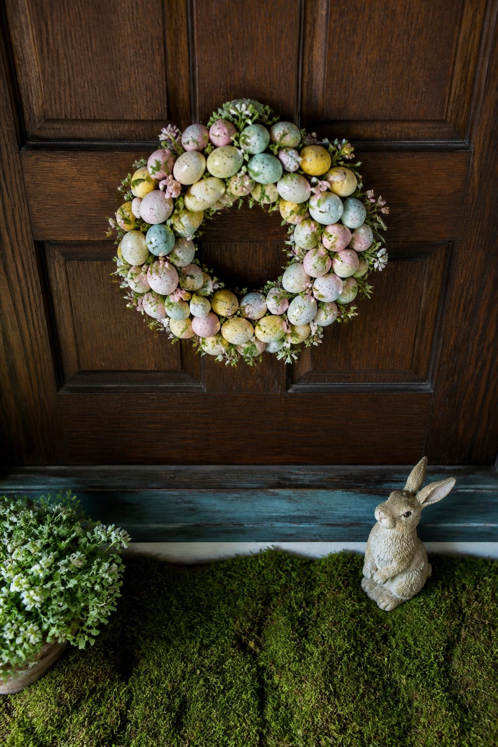A 16-inch egg wreath displayed on a door.