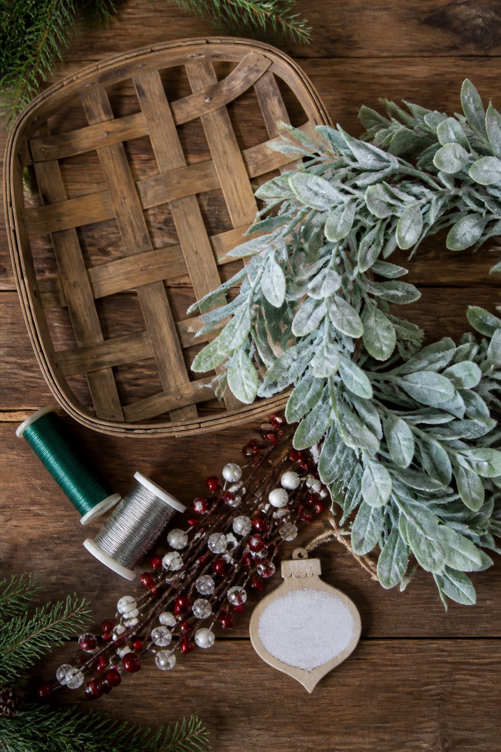 Tobacco Basket Christmas Wreath: 6 Steps for a Farmhouse Holiday Look 1 A tobacco basket and various crafting materials for a wreath.